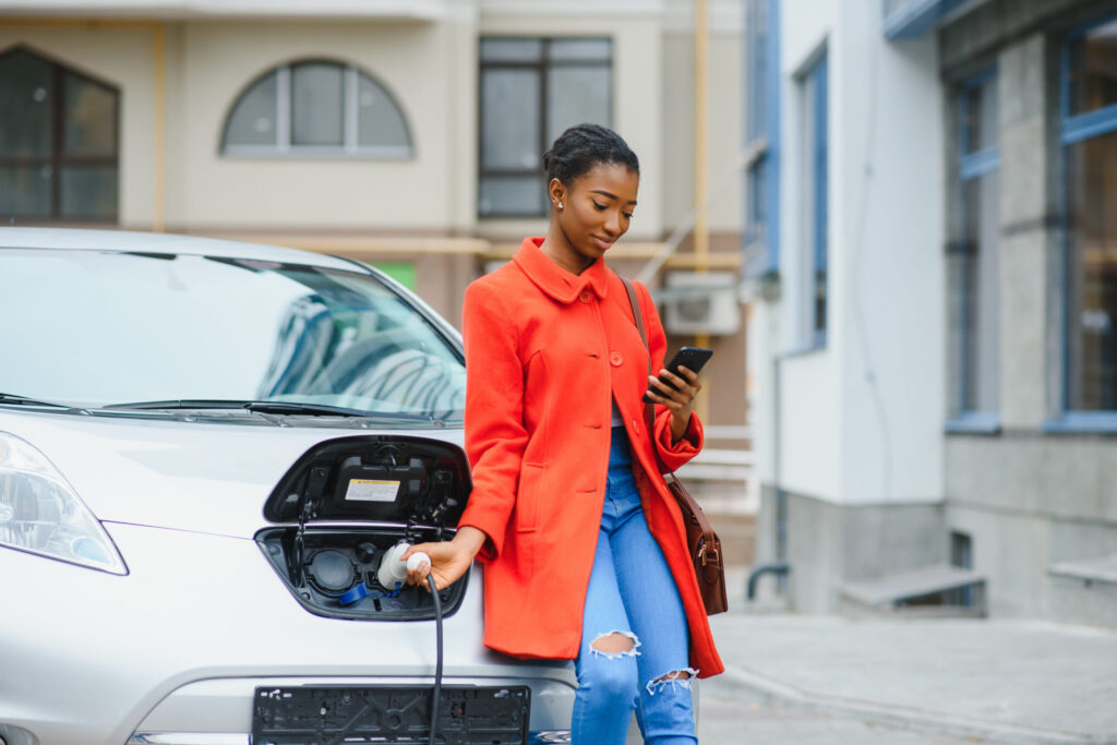 woman charging EV